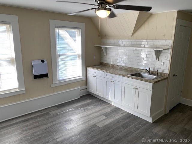 108 Washington Street Wallingford, CT 06492 - Photo 2 of 11 a kitchen with a sink cabinets and window