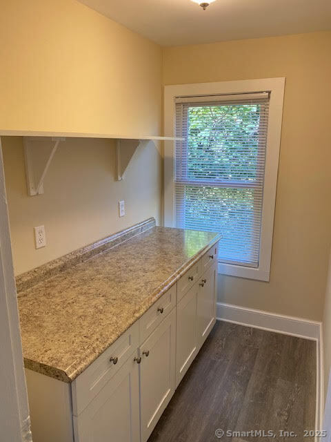 108 Washington Street Wallingford, CT 06492 - Photo 3 of 11 a view of cabinets and wooden floor