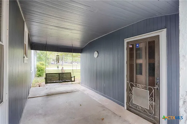 a view of empty room with floor to ceiling window