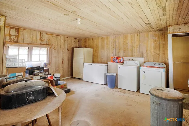 a bed room with a bed and a window