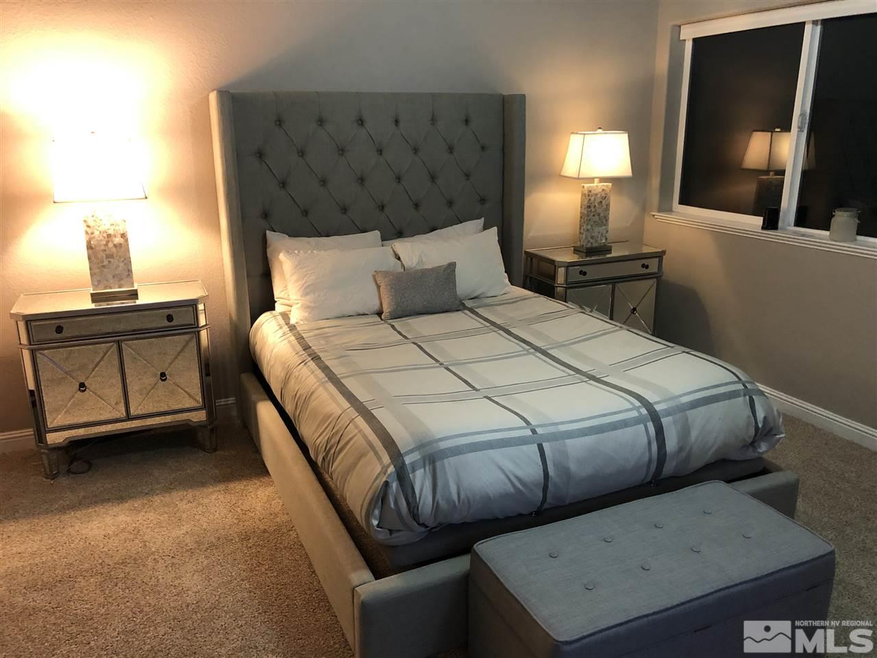 1970 Dickerson Road Reno, NV 89503 - Photo 8 of 21 a bed room with a bed and a night stand