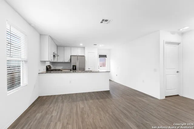 a view of kitchen with wooden floor