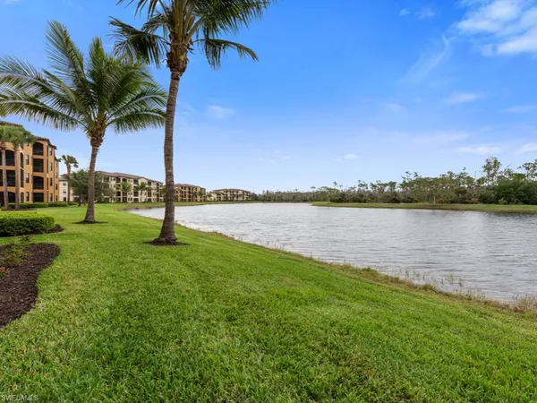 a view of a lake with a yard