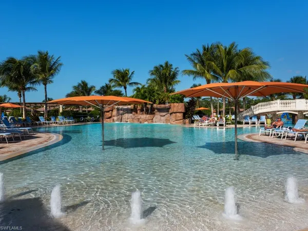 a view of swimming pool with outdoor seating