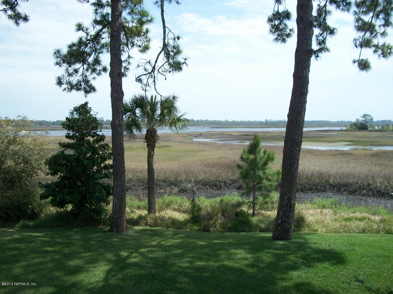 3387 Lighthouse Point Lane Jacksonville, FL 32250 - Photo 6 of 8 a view of lake with a yard