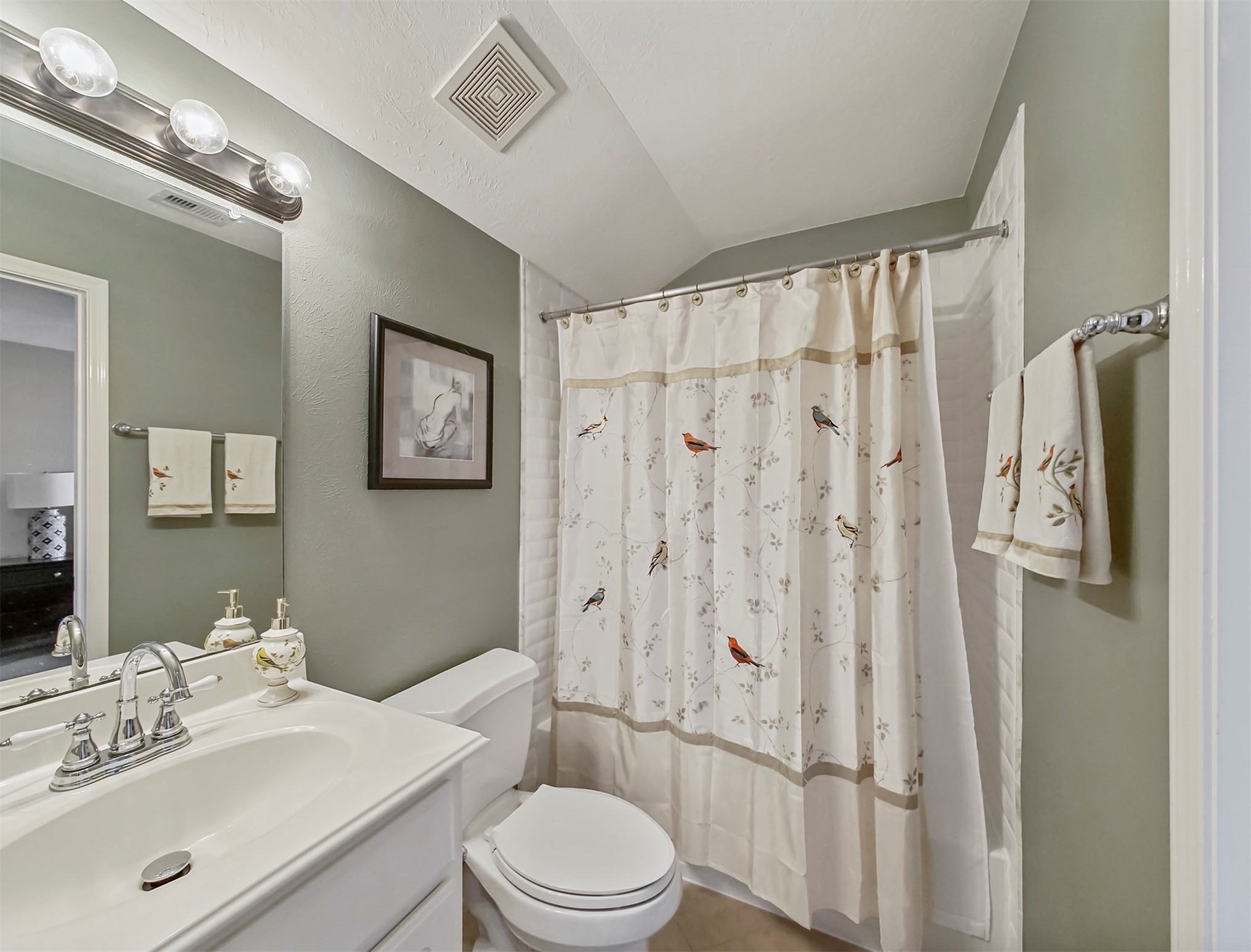 8214 Garrison Point Drive Houston, TX 77040 - Photo 21 of 37 a bathroom with a sink vanity mirror and toilet