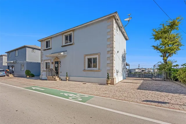 a view of a house with a street