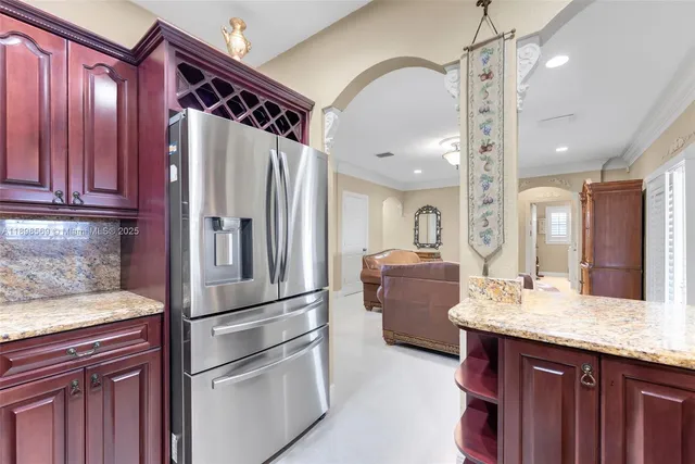 a kitchen with a refrigerator and a sink