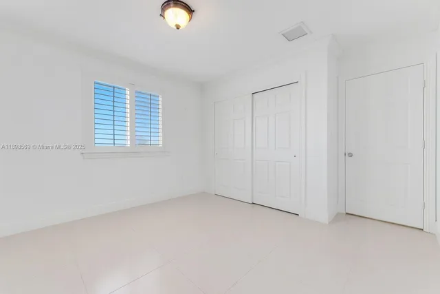 a room with windows and furniture