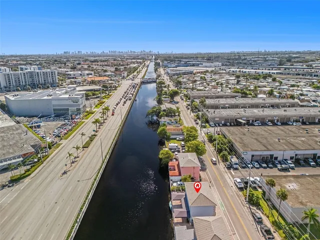 an aerial view of a house with a lake view