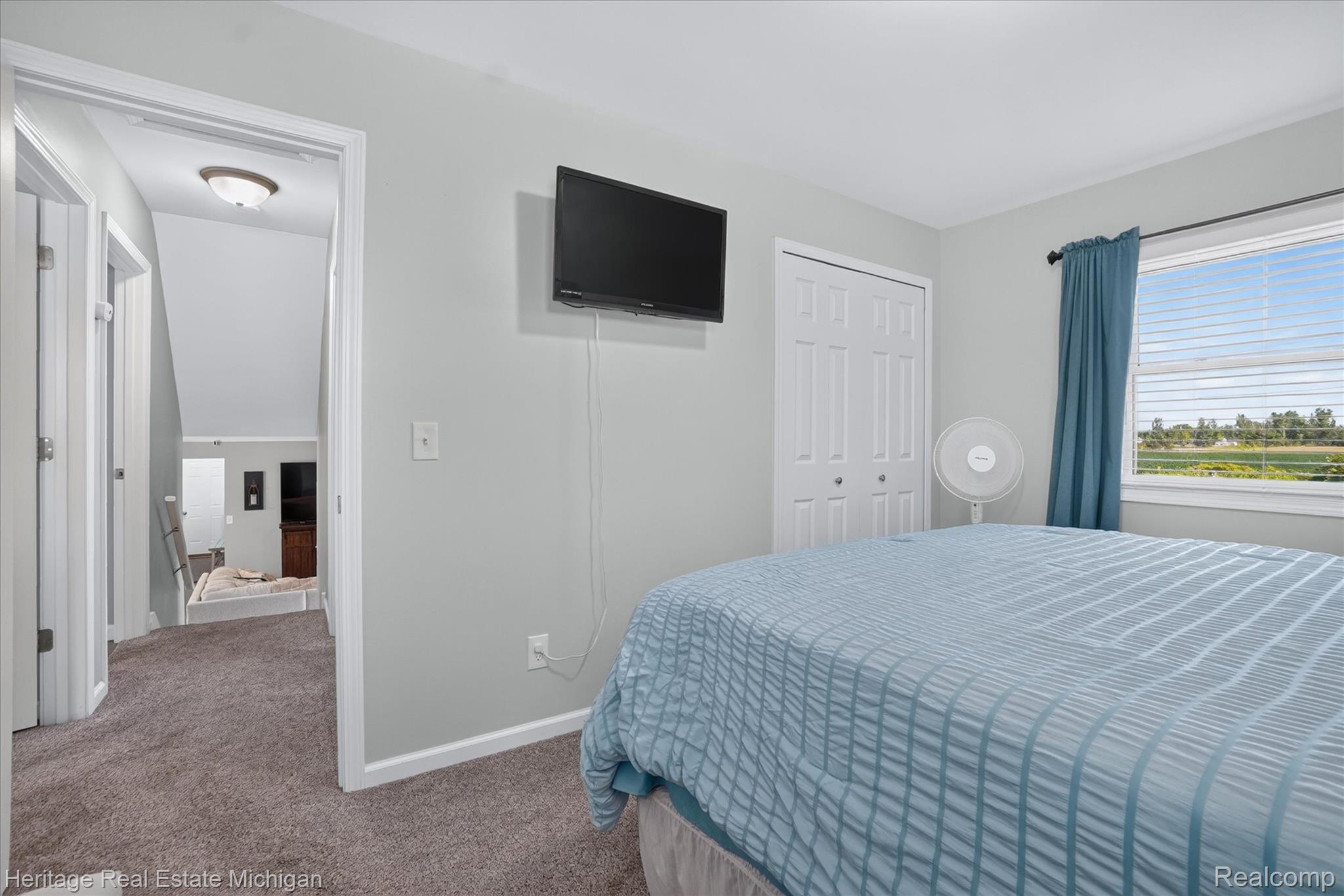 7225 Baldwin Road Swartz Creek, MI 48473 - Photo 18 of 44 Carpeted room with a double bi-fold closet and a large window