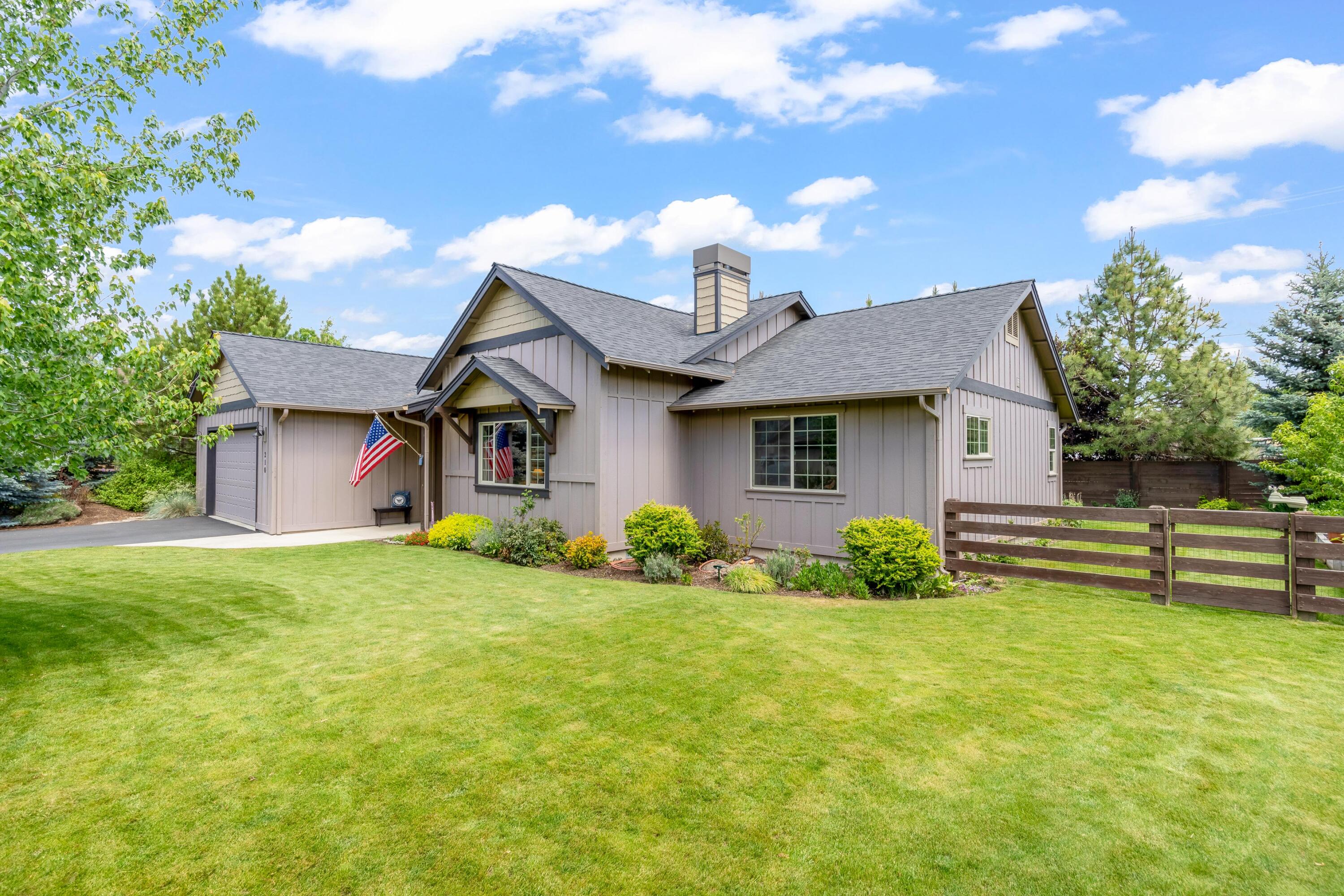 210 Northwest Saddle Ridge Loop Prineville, OR 97754 - Photo 31 of 38 a front view of a house with a yard