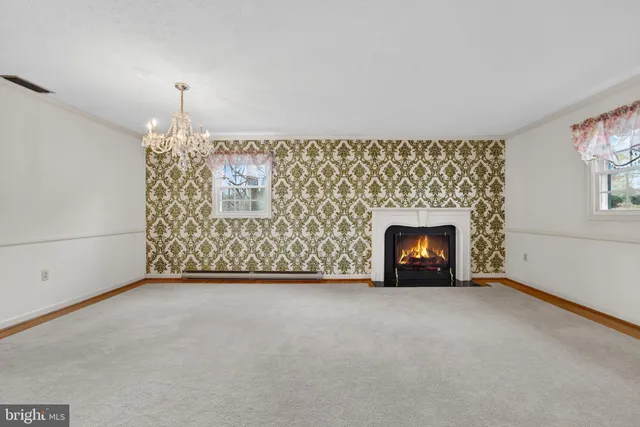 a view of an empty room with a fireplace