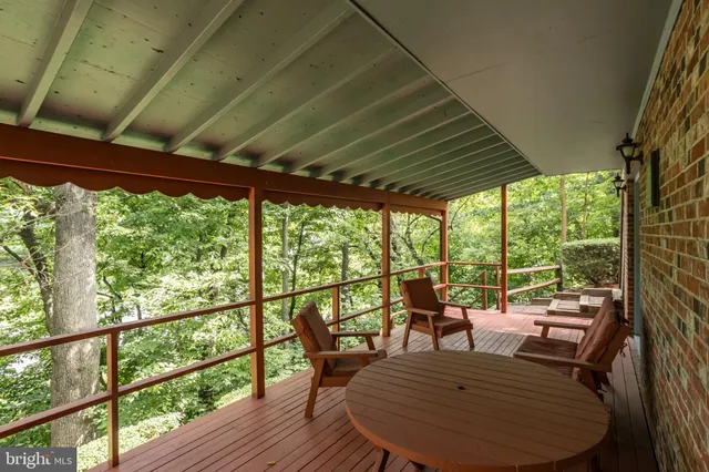 a view of a patio with table and chairs