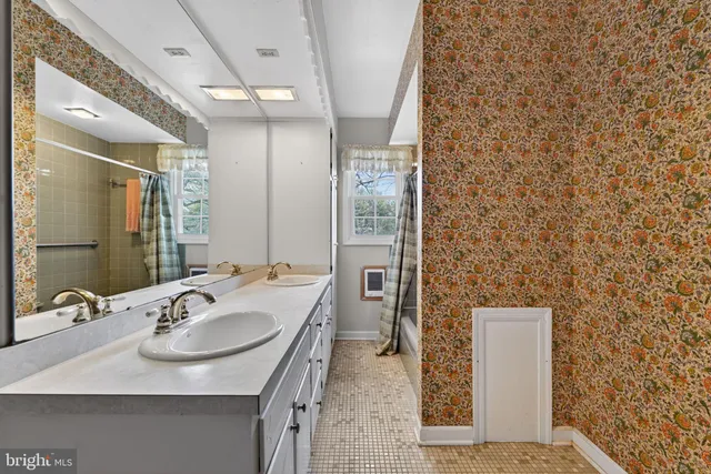 a bathroom with a shower and a bathtub