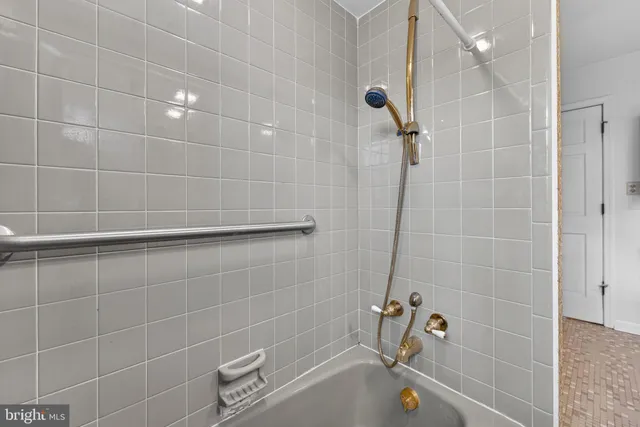 a view of an empty room and window with wooden floor
