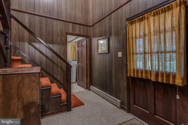 a view of staircase with wooden walls and stairs