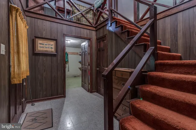 a view of staircase with wooden floor and stairs