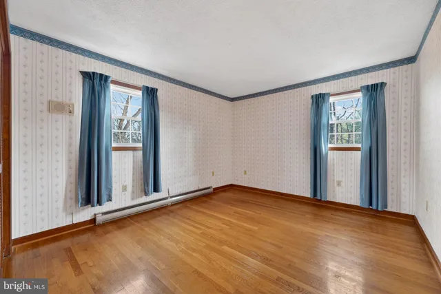a room with pool table table and sofas