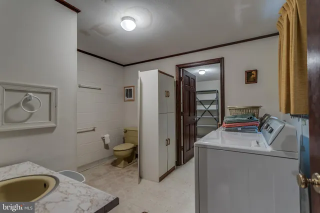 a view of a livingroom with furniture and windows