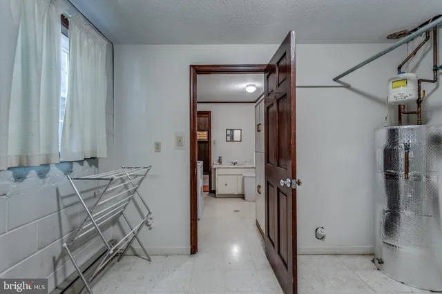 a view of front door of house with stairs