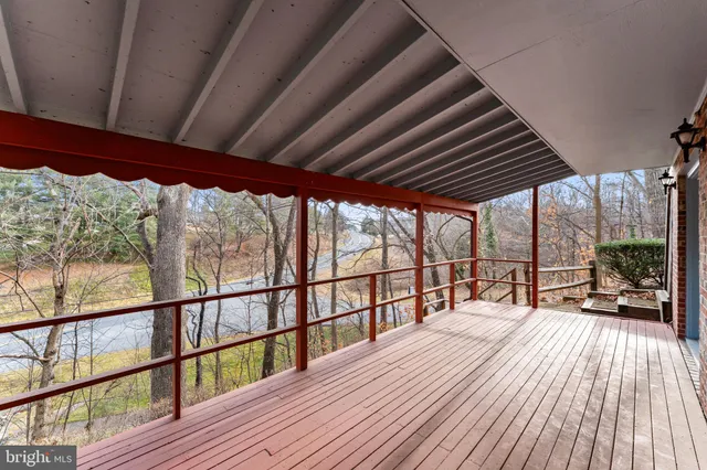 a view of a house with a yard covered in snow