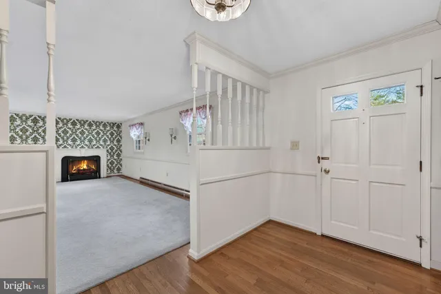 a view of a livingroom with an empty space and a fireplace