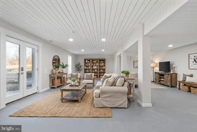 a bathroom with a shower a mirror and a sink