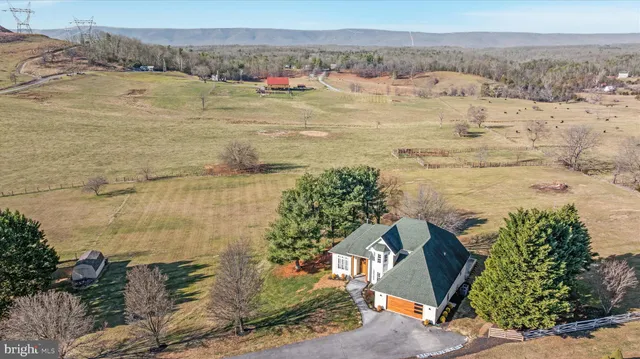 a view of a building with a street light and sign board