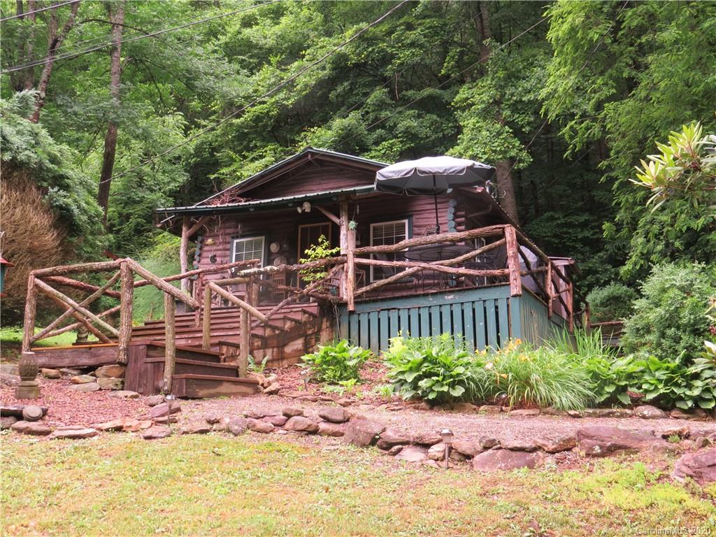 142 Cold Spring Road Burnsville, NC 28714 - Photo 1 of 34 an outdoor view of a house with garden