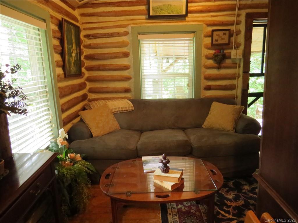 142 Cold Spring Road Burnsville, NC 28714 - Photo 13 of 34 a living room with furniture and a window