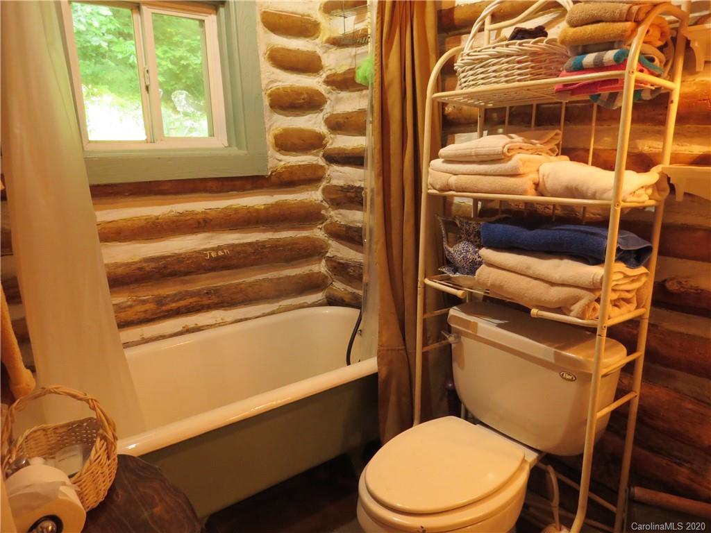 142 Cold Spring Road Burnsville, NC 28714 - Photo 23 of 34 a bathroom with a toilet and a shower