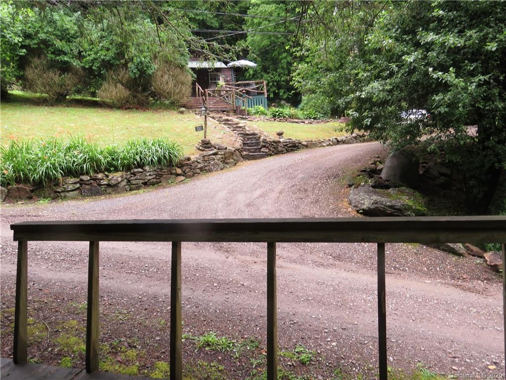 142 Cold Spring Road Burnsville, NC 28714 - Photo 33 of 34 a view of a yard with wooden fence