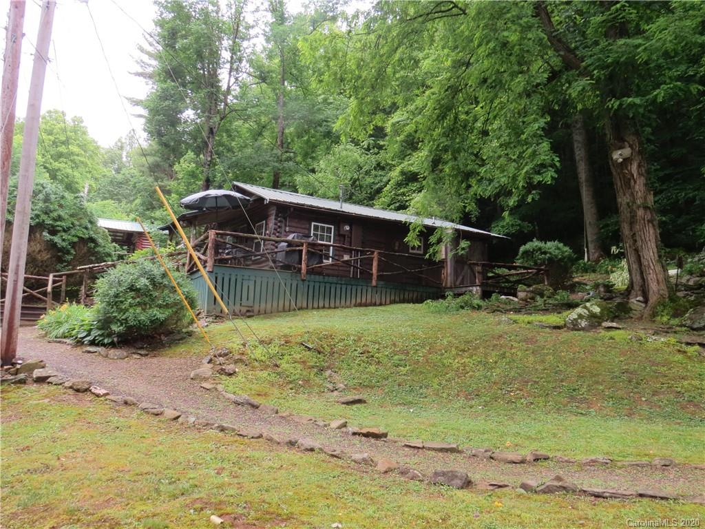 142 Cold Spring Road Burnsville, NC 28714 - Photo 6 of 34 a view of a wooden deck and a lake view