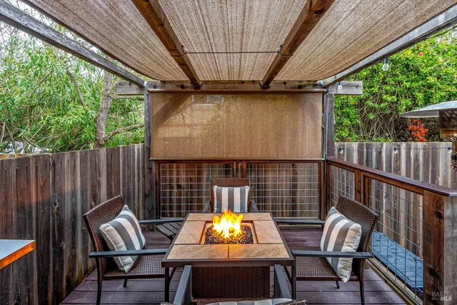 a view of patio with a table and chairs