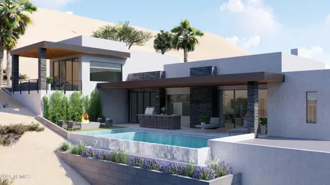 a view of a house with potted plants