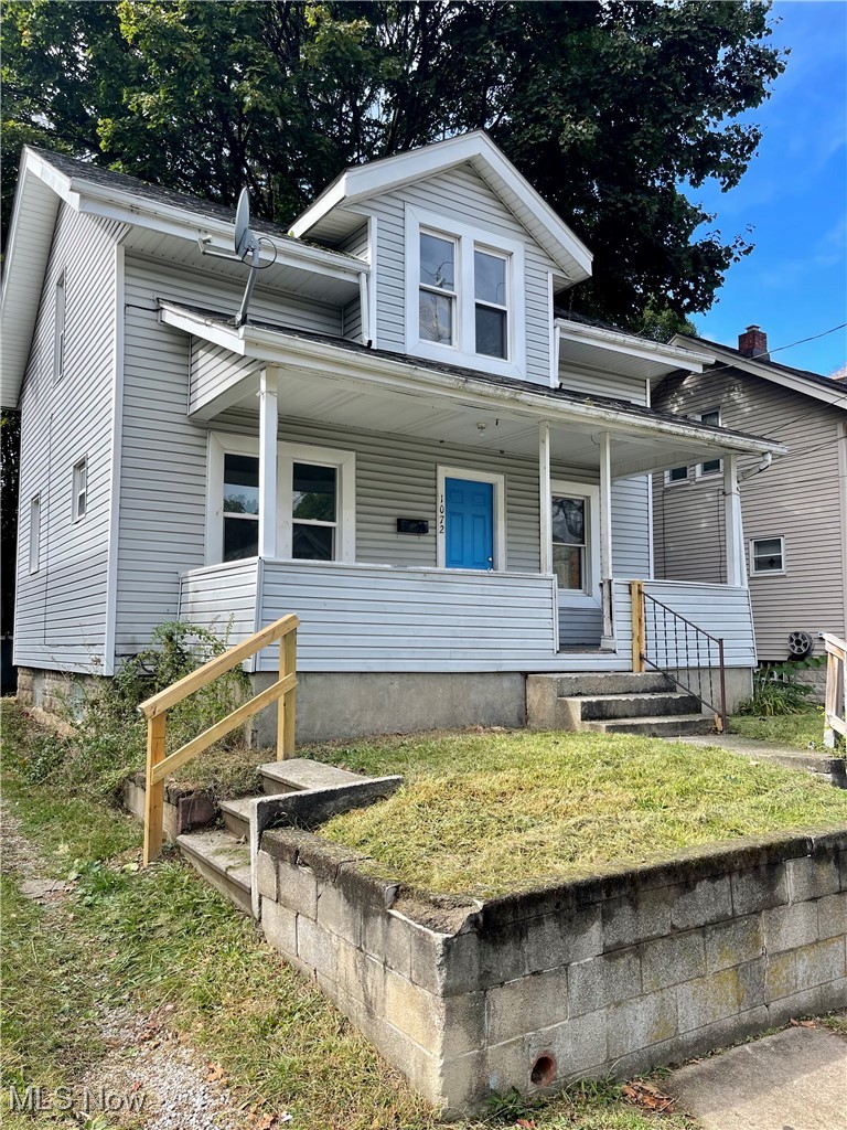 View of front of property with a porch