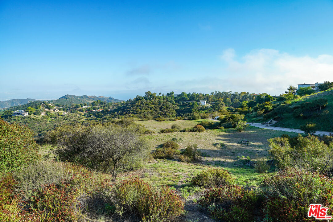 21653 Saddle Peak Road Topanga, CA 90290 - Photo 1 of 71 a view of a lake view with houses in back