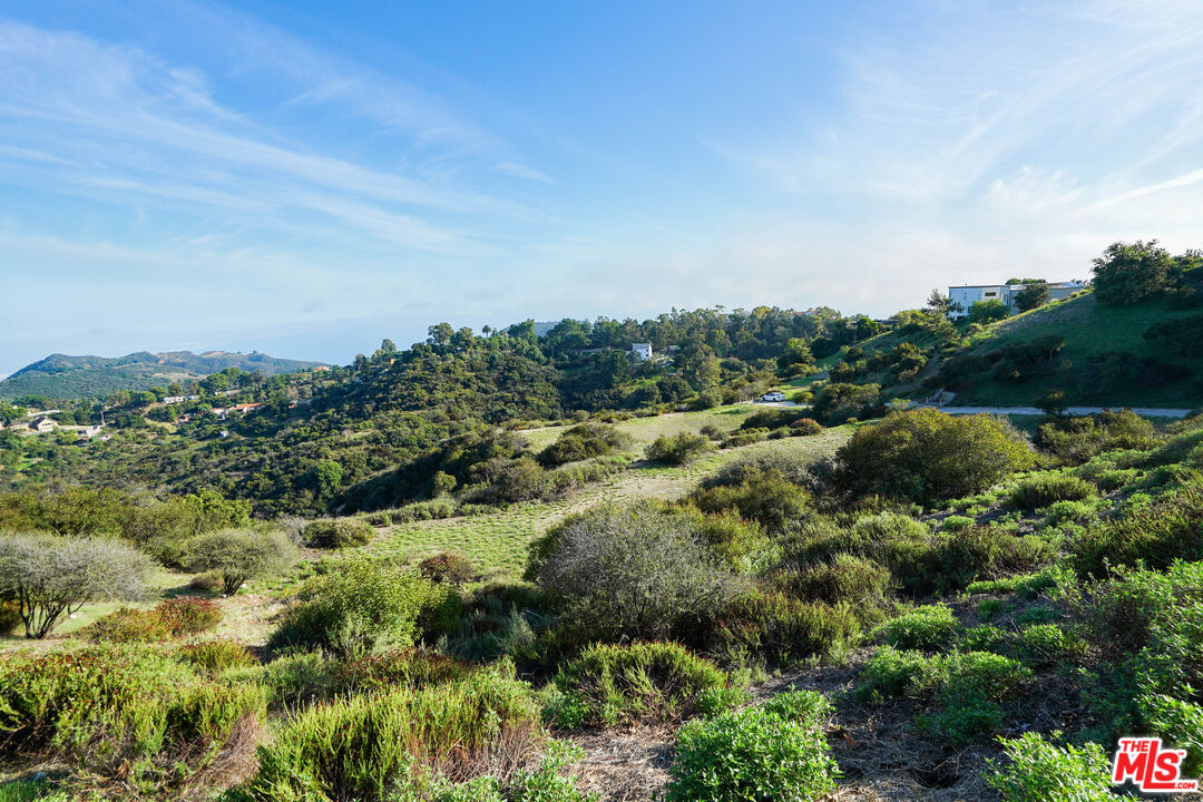 21653 Saddle Peak Road Topanga, CA 90290 - Photo 20 of 71 a view of a lake with houses in back