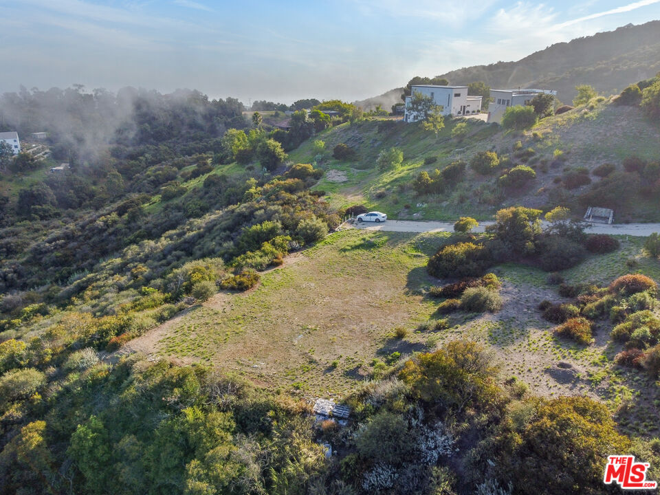 21653 Saddle Peak Road Topanga, CA 90290 - Photo 27 of 71 a view of a lake with mountains in the background