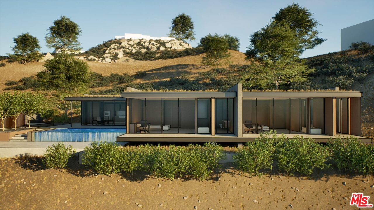 21653 Saddle Peak Road Topanga, CA 90290 - Photo 4 of 71 a front view of a house with garden