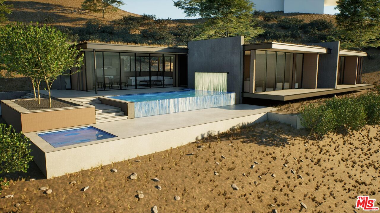 21653 Saddle Peak Road Topanga, CA 90290 - Photo 47 of 71 a view of house with backyard and seating space