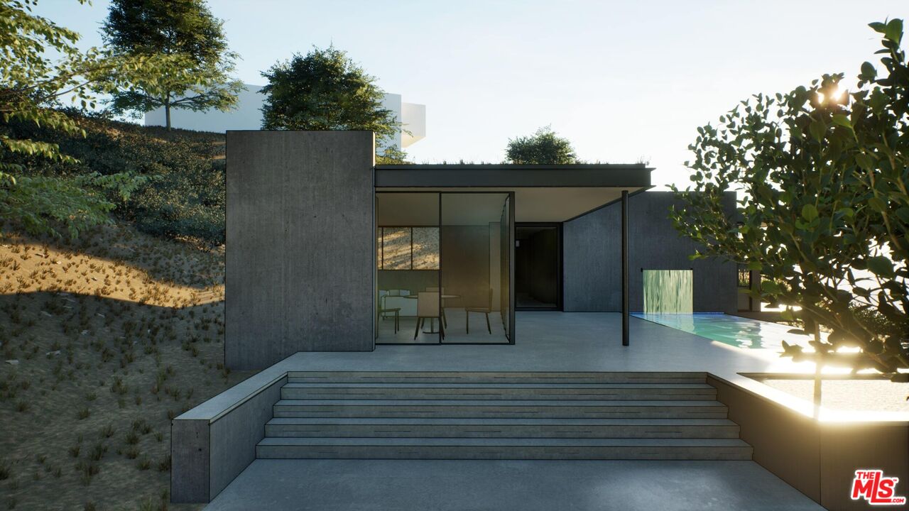 21653 Saddle Peak Road Topanga, CA 90290 - Photo 51 of 71 a front view of a house with a yard