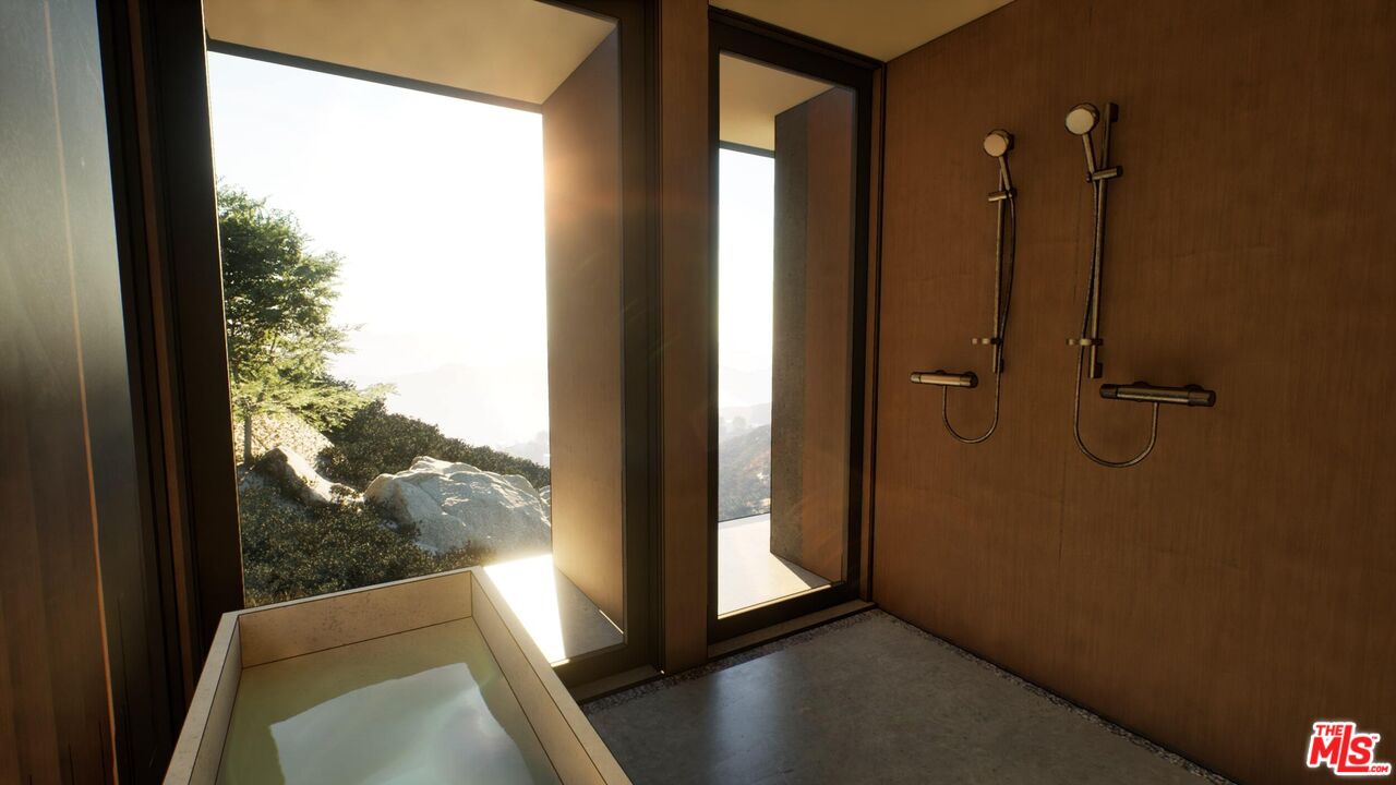 21653 Saddle Peak Road Topanga, CA 90290 - Photo 70 of 71 an empty room with wooden floor and windows