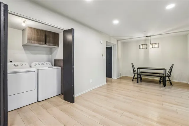 a view of kitchen with furniture and wooden floor