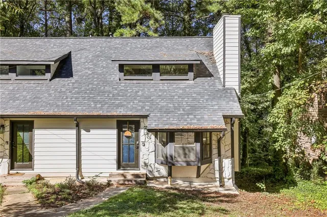 a front view of a house with garden