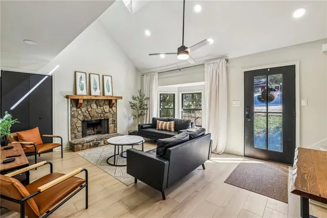 a living room with furniture and a fireplace