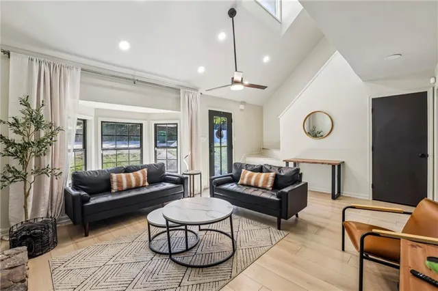 a living room with furniture and a large window