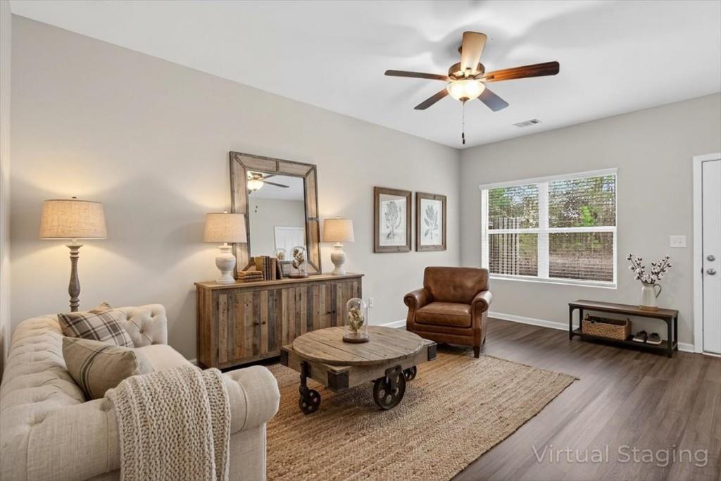 107 Brexley Drive Calhoun, GA 30701 - Photo 12 of 36 a living room with furniture and a window