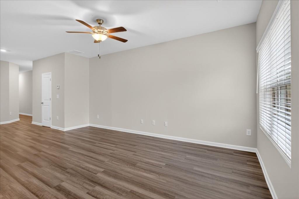 107 Brexley Drive Calhoun, GA 30701 - Photo 14 of 36 wooden floor in an empty room with a window